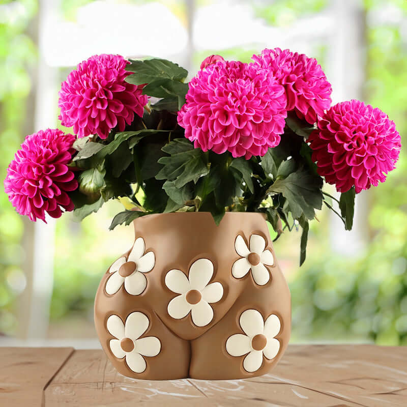 Home Decor vase with pink flowers and floral design, perfect accent for any home decor.