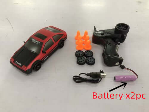 Remote Control Drift Racing Car with battery, remote, cones, and spare wheels set