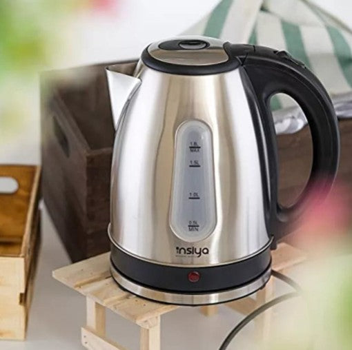 Stainless Steel Electric Kettle on a wooden stand, perfect for stylish tea serving and everyday use.