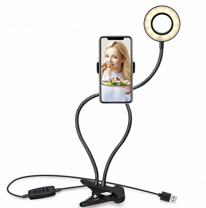 LED selfie ring light with phone holder, adjustable angles for makeup and photography, hands-free use.