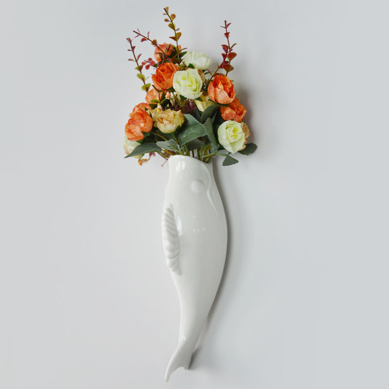 Simple modern ceramic wall goldfish vase with flowers, perfect wall decoration for living room or bedroom.