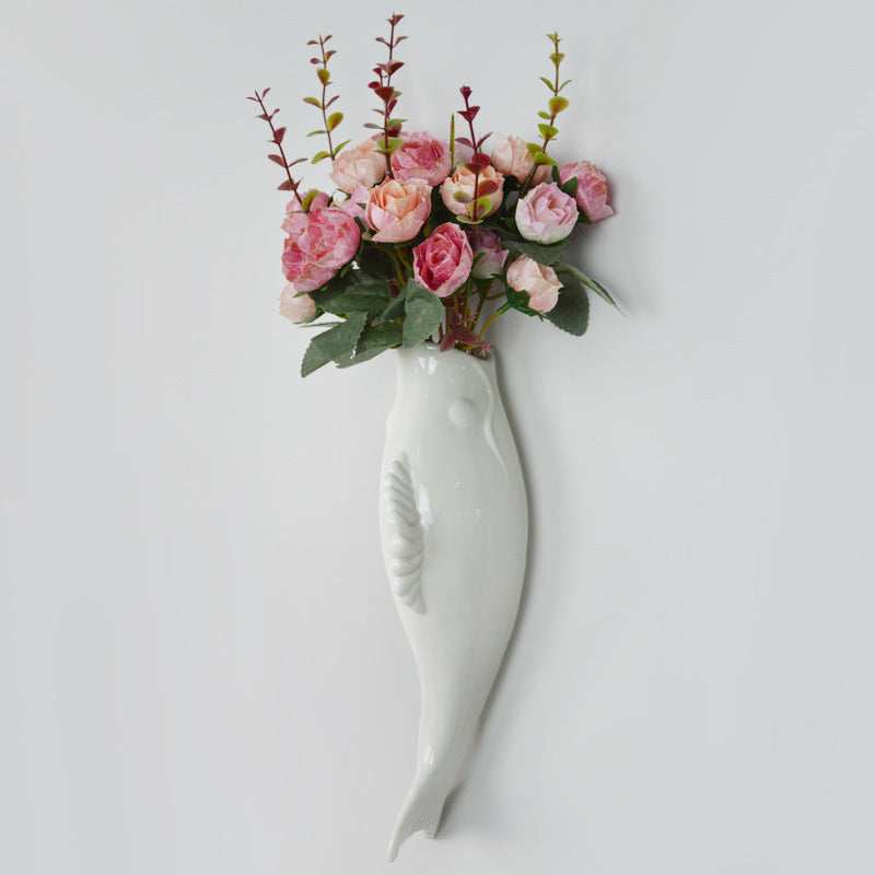 Simple Modern wall ceramic goldfish vase with flowers for wall decoration in living room.