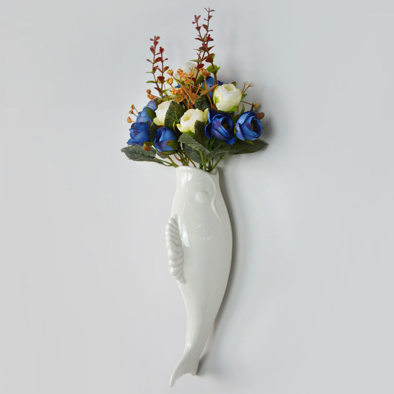 Simple modern ceramic wall goldfish vase with colorful flowers, perfect for wall decoration in living room or bedroom.