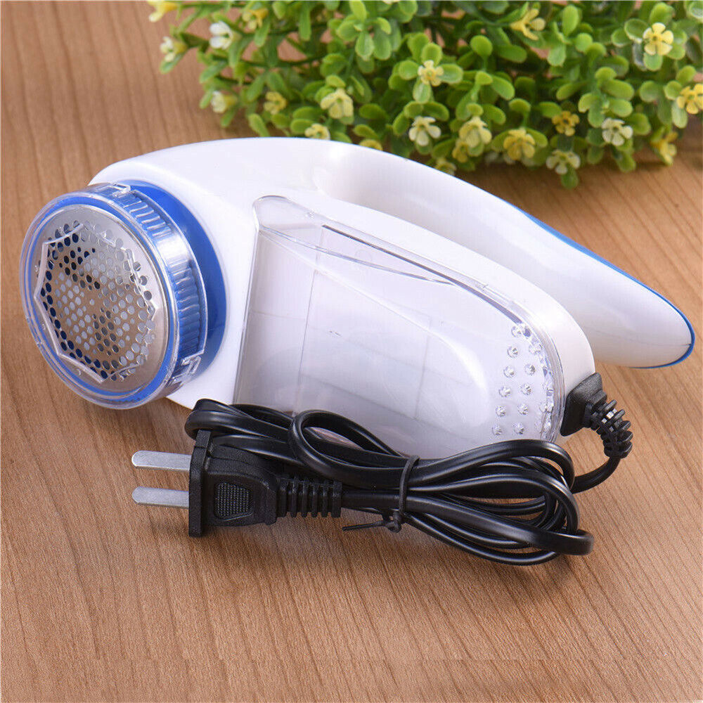 Lint remover and fabric shaver in white and blue, designed for removing fuzz balls from clothes and blankets.