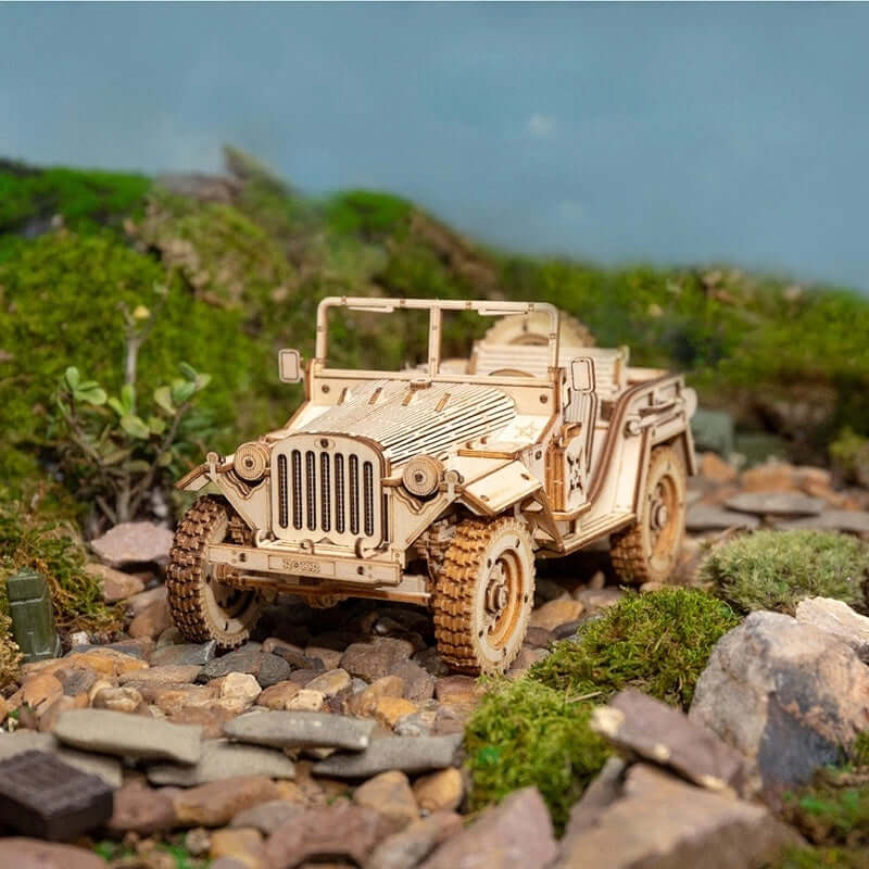 3D Wooden puzzle model of a vintage army jeep on rocky terrain, showcasing detailed craftsmanship.