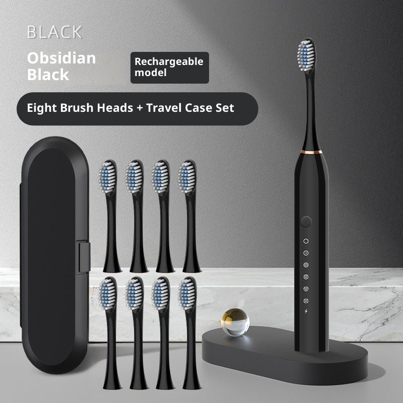 Soft-bristle toothbrush with eight brush heads and travel case set in obsidian black color.
