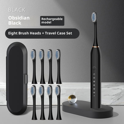 Soft-bristle toothbrush with eight brush heads and travel case set in obsidian black color.