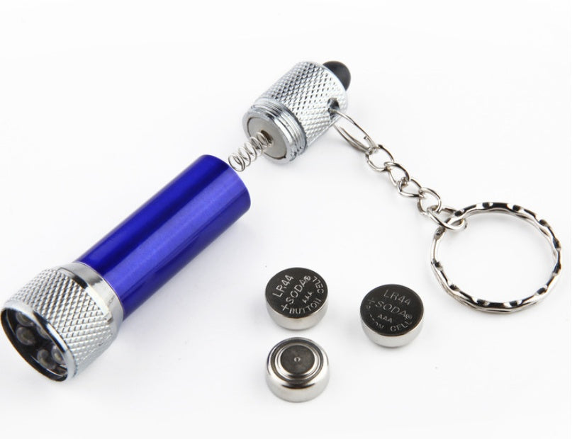 Emergency night light flashlight portable LED torch keychain with batteries and blue aluminum body.