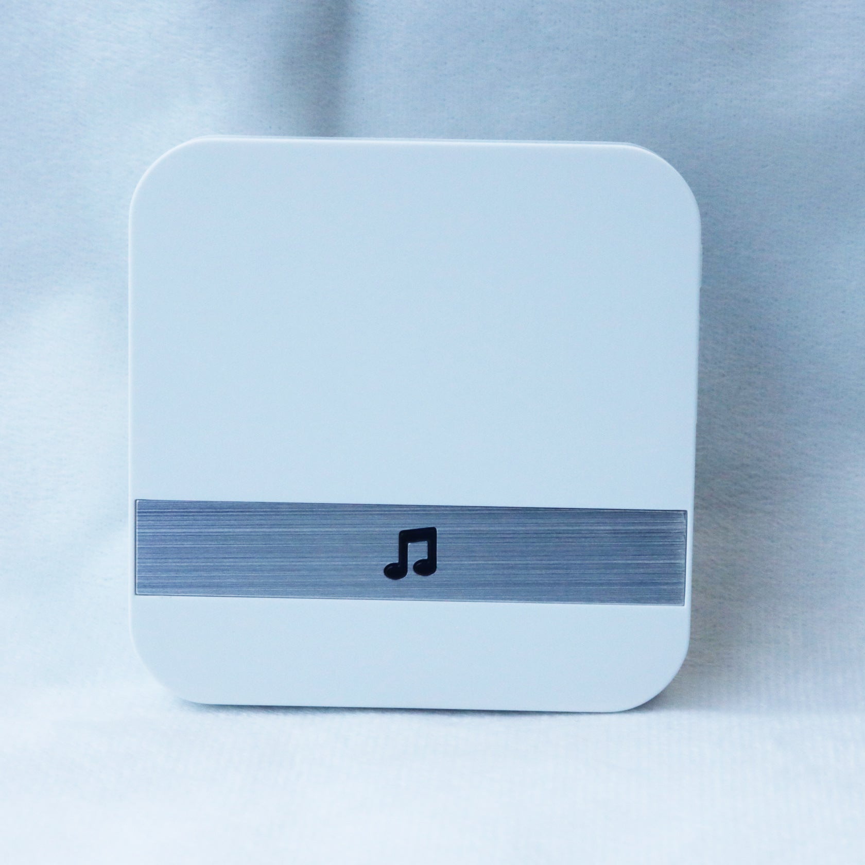 Smart music player device with a note icon, sleek white design, modern look for audio entertainment