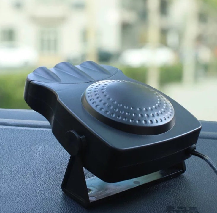Portable windshield defroster mounted on a car dashboard, featuring a sleek black design.