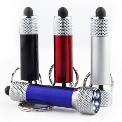 Set of portable LED torch keychain flashlights in black, red, silver, and blue, perfect for emergency situations.