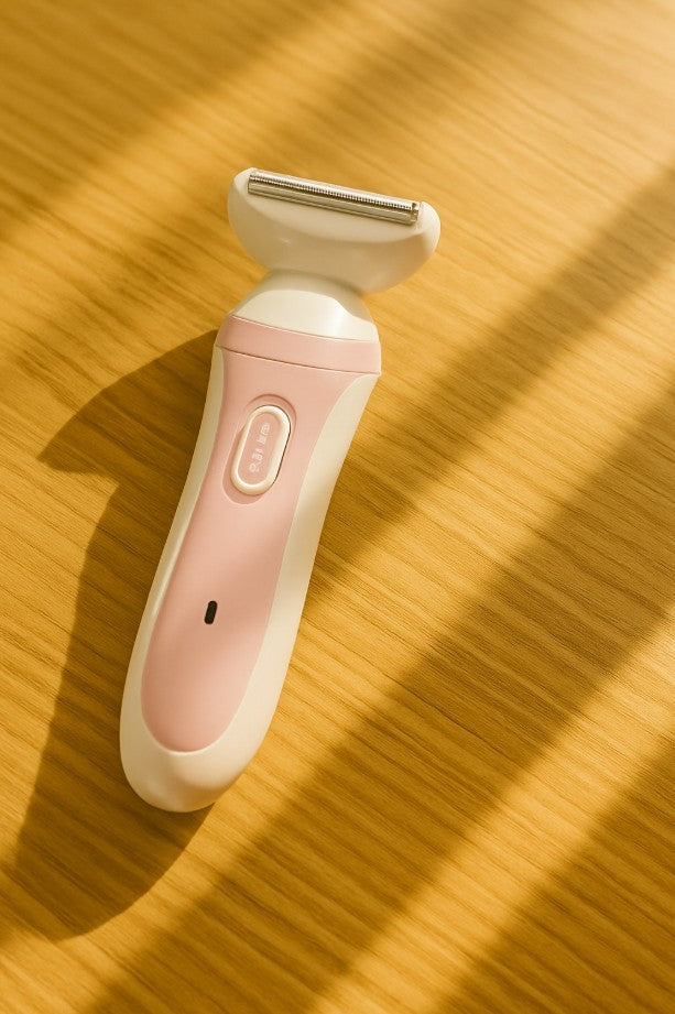 Electric Women Shaver resting on a wooden surface, showcasing its sleek design and grooming capabilities.