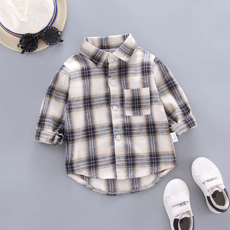 Kids Plaid Long Sleeve Shirt laid flat with sunglasses and shoes on a gray background