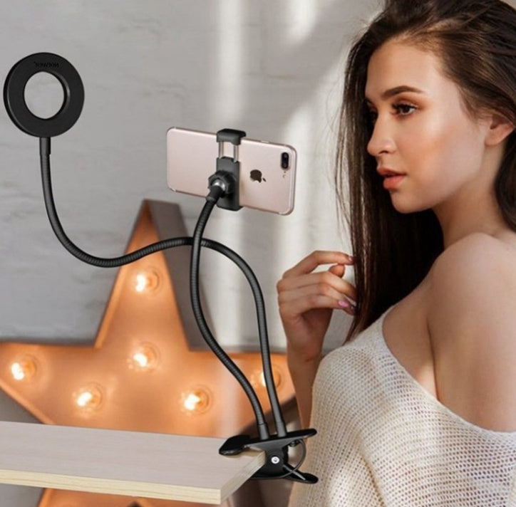 LED selfie ring light with adjustable phone holder for makeup and live streaming, featuring 360-degree rotation.