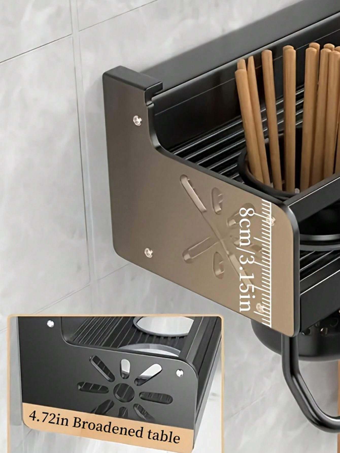 Close-up of wall-mounted kitchen rack with measurement scale and wooden utensils in holder.