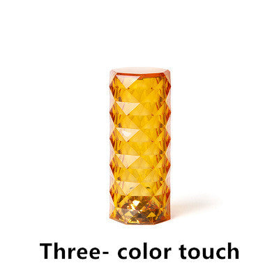 Nordic crystal lamp with three-color touch functionality, showcasing its diamond design and warm lighting for bedroom decor.