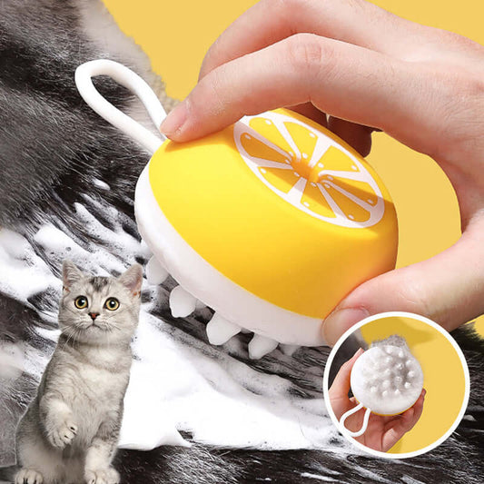 Silicone pet cleaning & grooming comb in hand, with yellow color and 3D massage head for effective grooming.