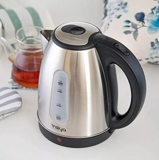 Stainless Steel Electric Kettle in a modern kitchen setting, showcasing sleek design and tea brewing.
